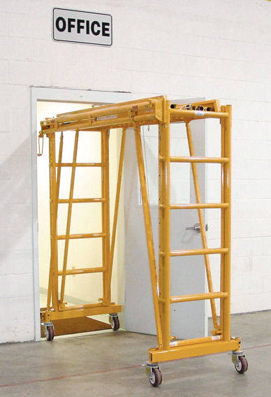 work platform scaffolding rolls through doorway